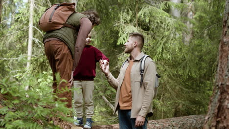 family walking in the forest