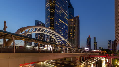 A-day-to-night-4K-static-time-lapse-with-an-ultra-wide-lens-,-shot-at-Chongnonsi-Junction,-Bangkok,-Thailand