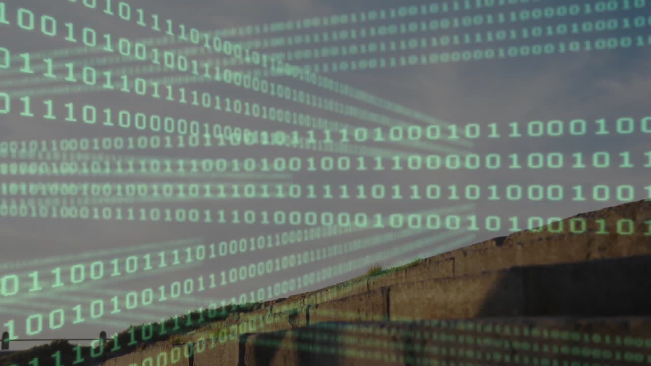 Binary code overlay streaming across rooftop concrete wall, showing digital technology data flow