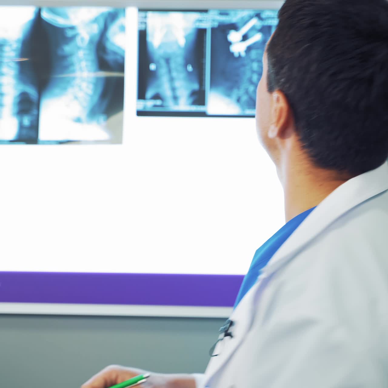 Male doctor analysing x ray