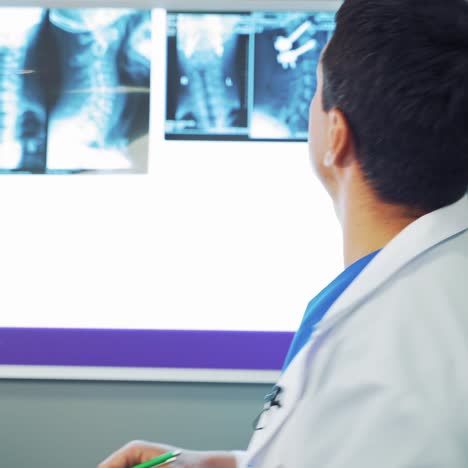 male doctor analysing x ray