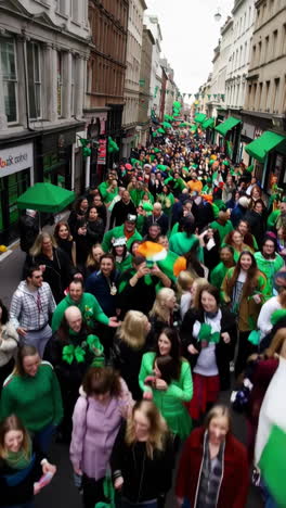 st. patrick's day parade with irish flags and cheerful crowds