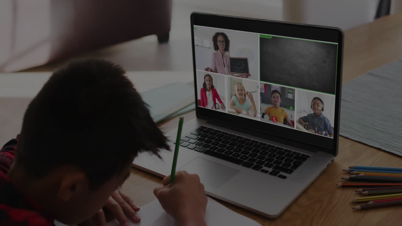 Boy writing at table, remote class starting and HUD graphics over laptop showing cloud security