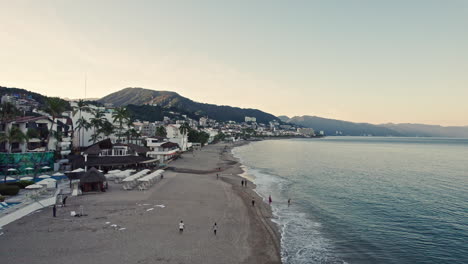 The-vast-and-beautiful-coastline-of-Puerto-Vallarta-is-observed,-flying-over-the-coast,-appreciating-the-city-and-the-sea