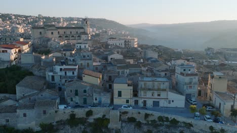 Aerial-view-of-Modica-Alta-Val-di-Noto-Sicily-Old-Baroque-Town-Church-South-Italy-at-Sunrise