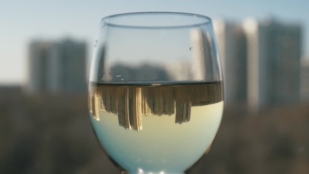 Cityscape Reflected in Wine Glass