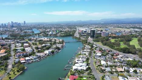 Panoramic-scene-on-the-iconic-Gold-Coast,-Broadbeach-in-the-distance,-luxury-waterfront-homes-,-aerial-view