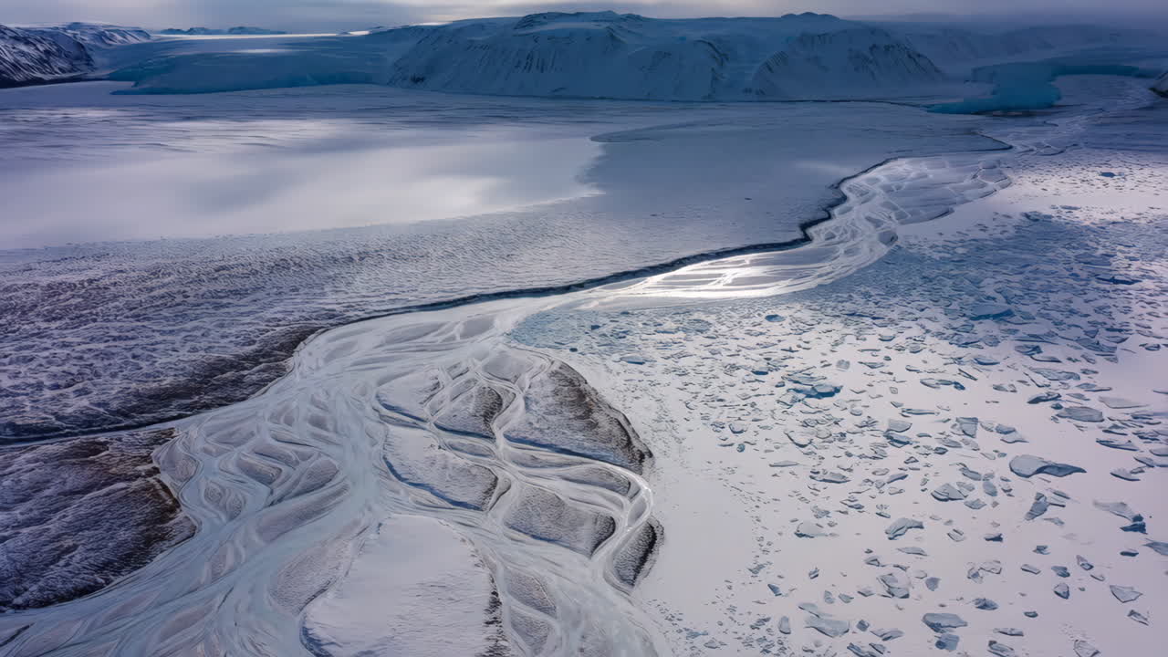 Aerial View of Glacial Meltwater Channels in an Icy Landscape
