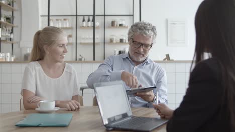 health insurance agent and customers meeting in co-working space