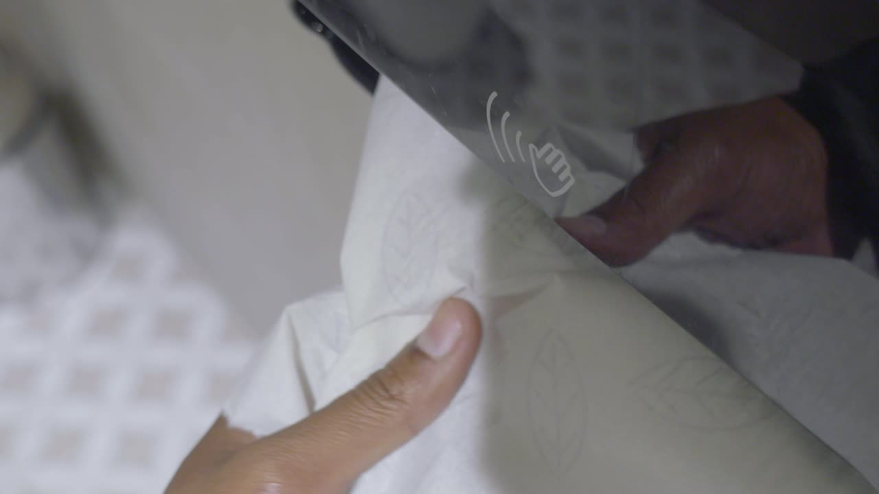 Hand Dispensing Paper Towel from Automatic Touchless Dispenser