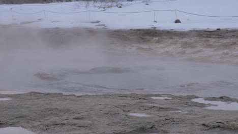 static close up shot of the great geysir stirring ready to explode in southwestern iceland