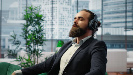 vertical video director pauses for a moment of calmness listening to meditation sounds