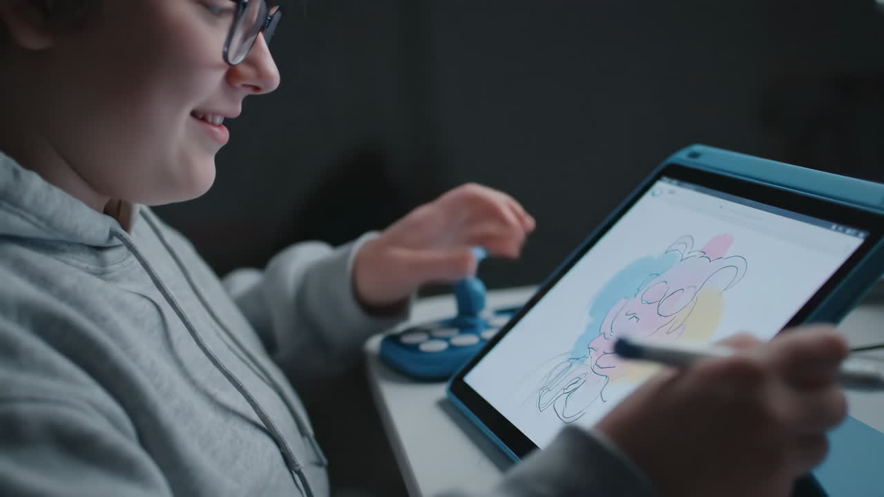 A boy creating digital art on a tablet