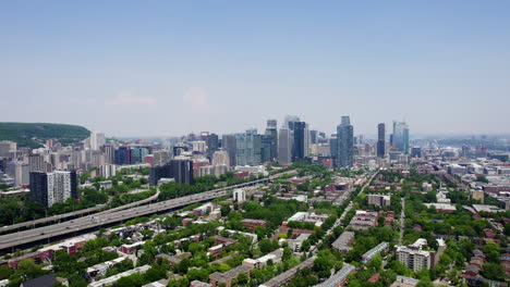 Drone-shot-panning-over-the-Petite-Bourgogne-district,-summer-in-Montreal,-Canada