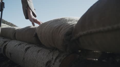 a world war trench view, soilder puts bags