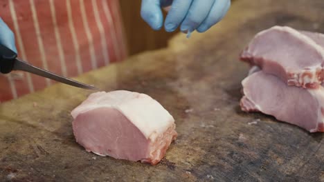 close-up slicing raw pork chops