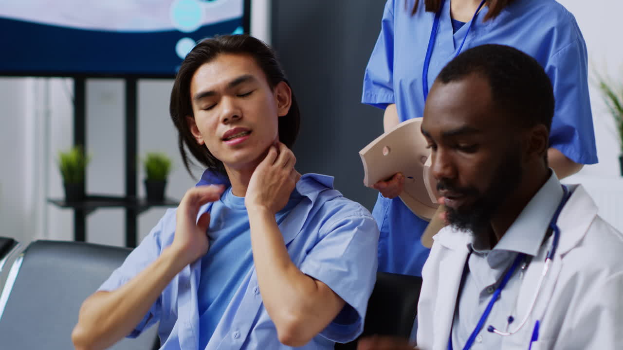 Doctor consulting with patient about neck injury