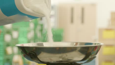 Pouring-sugar-into-a-scales-at-slow-motion