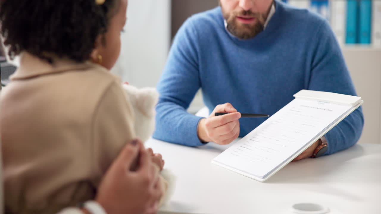 Doctor Consulting with a Child Patient