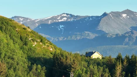 forest home and mountain scenery in bovaer, senja island, norway