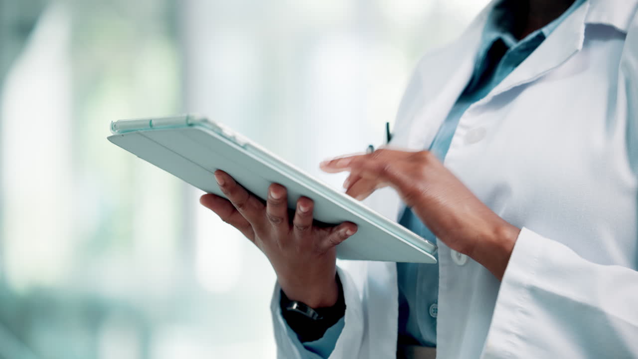 Medical Professional Using Digital Tablet for Data Analysis