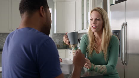 mixed race couple talking in the kitchen, close up, shot on r3d