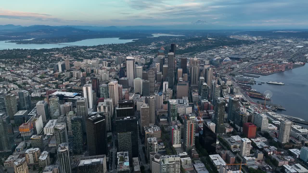 High up aerial view of Seattle's sea of skyscrapers at sunset