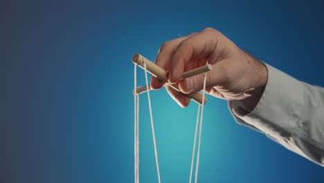 Person Holding Puppet Strings