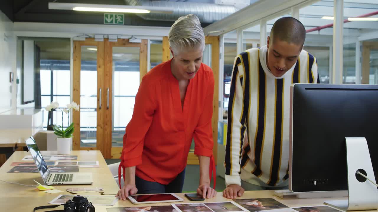 Woman and man working in a creative office