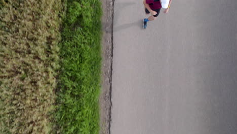 Overhead-View-Of-A-Man-Jogging-In-The-Road