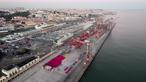 port of lisbon portugal with cranes and containers