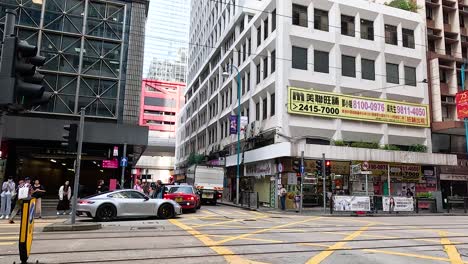 cars and pedestrians at a city intersection