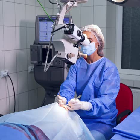 ophthalmologist looks in the microscope