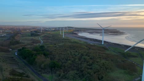 Coastal-wind-farm-windmills-at-golden-hour