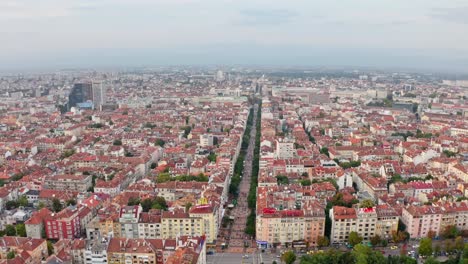 Rooftops,-skyline-of-Sofia,-Bulgaria-on-a-cloudy-day,-aerial-orbit-old-town