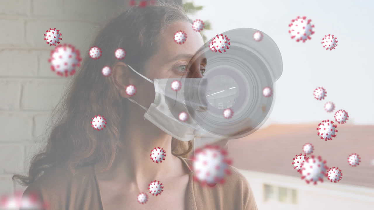 Coronavirus cells spreading over woman with mask and security camera.