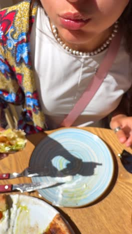 woman eating a delicious pizza