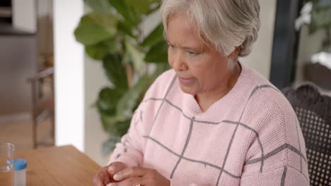 Senior-biracial-woman-using-tablet-for-medical-consultation,-slow-motion