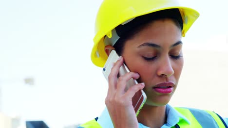 Engineer-calling-on-smartphone-and-gesturing