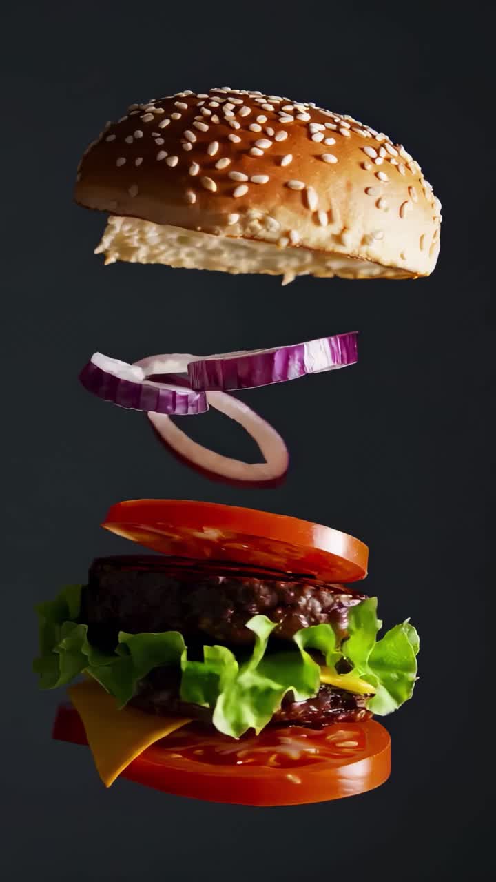 A video captures a floating burger with ingredients layered mid-air