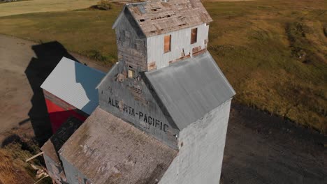 dorothy, alberta, canada : abandoned grain elevator in the ghost town of dorothy in canada at sunset