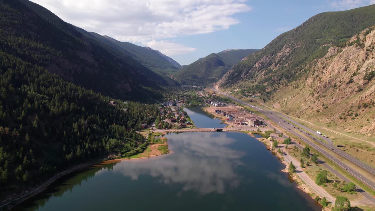 Aerial static video of Georgetown in Colorado. Camera is facing approximately south while the town is visible and traffic can be seen on the right on highway 70.