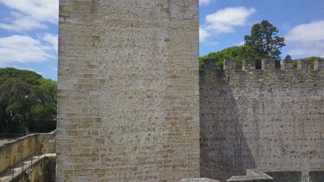 lateral shot of attractive medieval castle surrounded with trees, lisboa