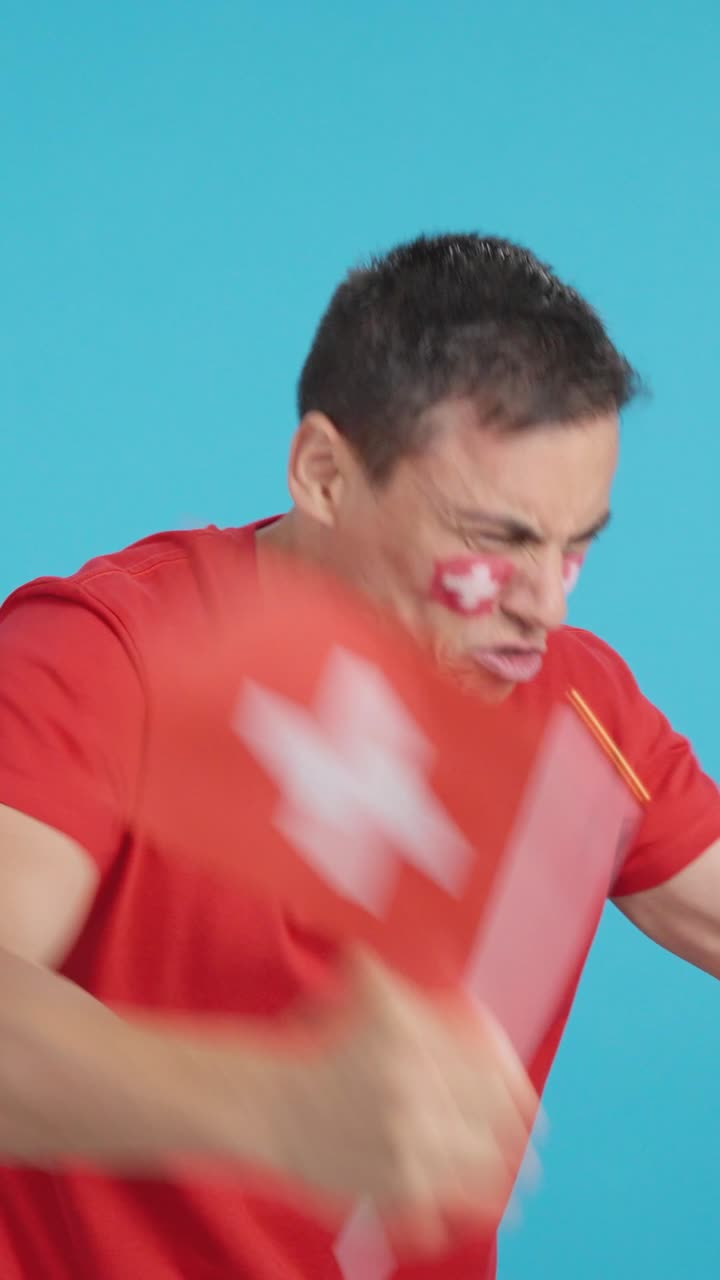 Man cheering for Switzerland, angry with the decision of referee