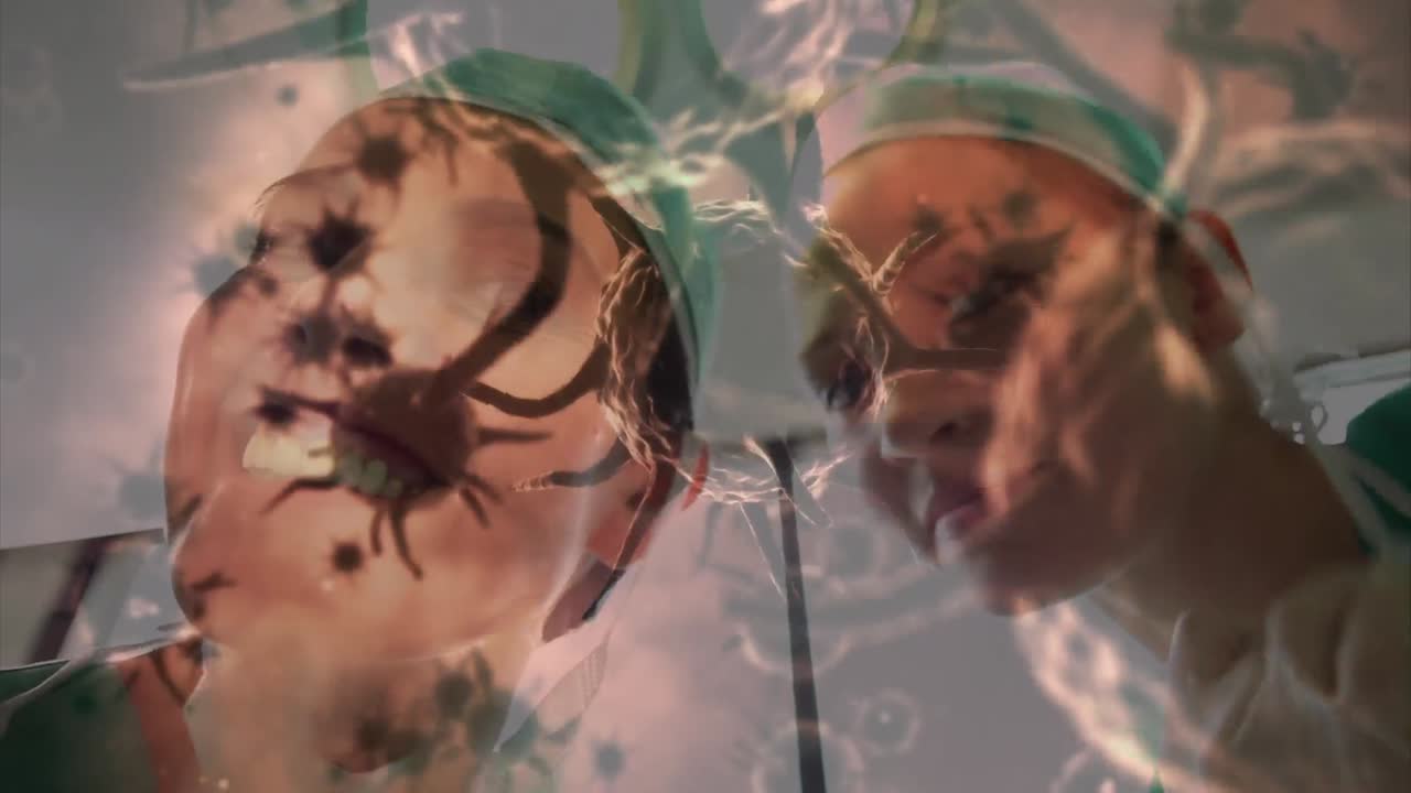 animación de células de covid-19 sobre diversos cirujanos que usan máscaras faciales en el quirófano