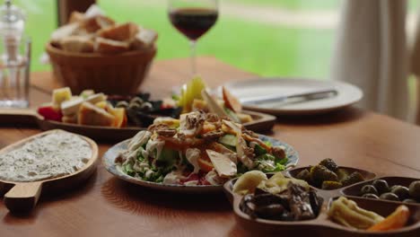table with local balkan food dishes and fresh ingredients - soft focus