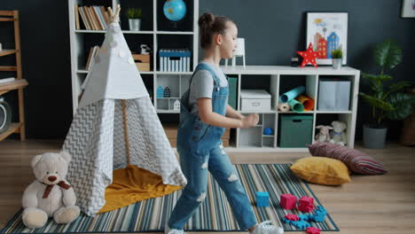 girl playing in kids room