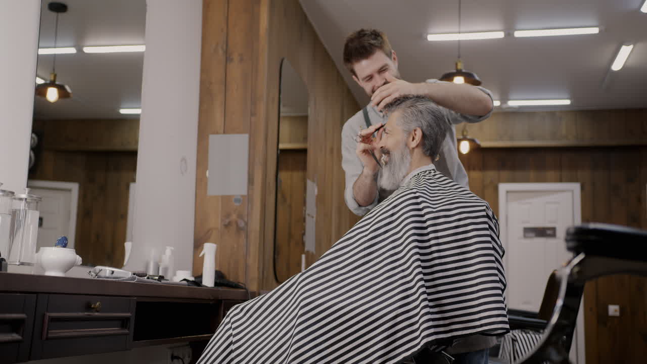 Senior Man Getting a Haircut at a Barber Shop