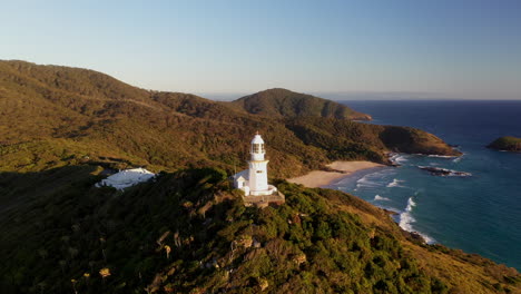 cinematic drone shot rotating around smoky cape lighthouse in australia