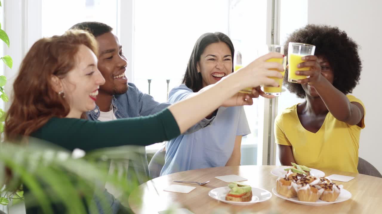 Friends Celebrating with Juice and Snacks